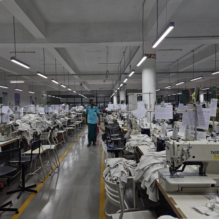 Factory supervisor inspecting workstations