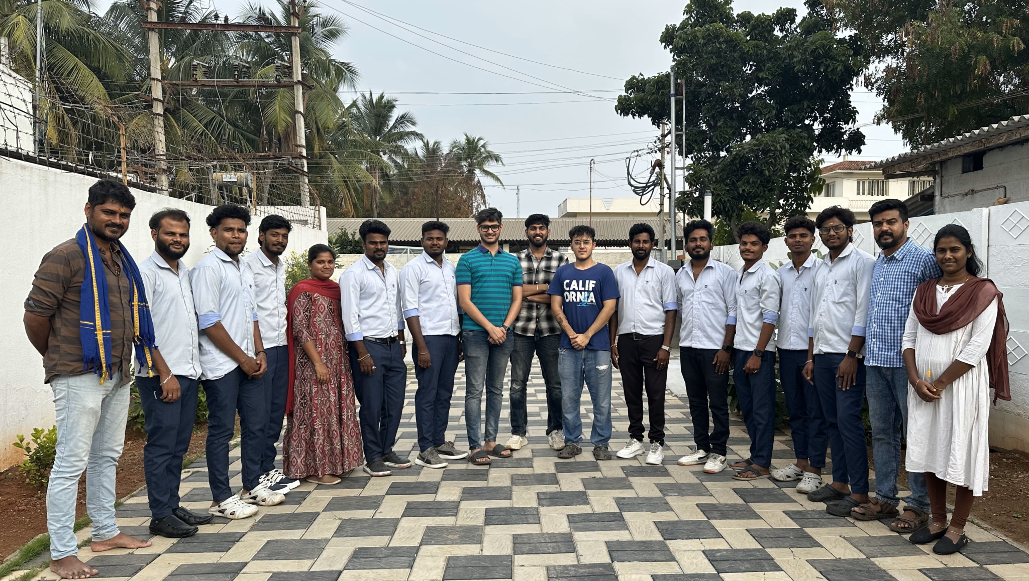 Uljah team group photo outside factory